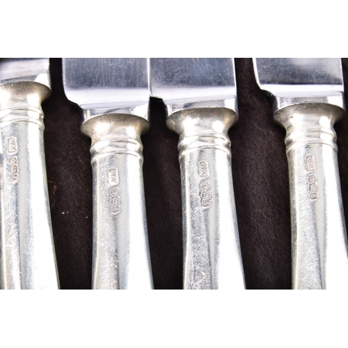 188 - A large collection of silver handled knives, including twenty-four tapered silver handled table kniv... 