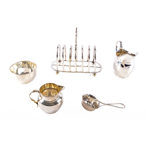 197 - A George V silver creamer hallmarked for Birmingham 1912 by T H Hazlewood & Co, 6.5 cm high, a G... 