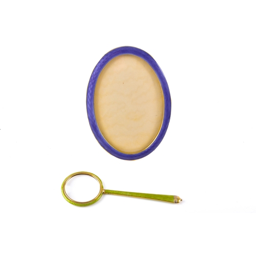 201 - A Norwegian silver gilt oval photograph frame, decorated with purple enamel, overall size 11 x 8 cm,... 