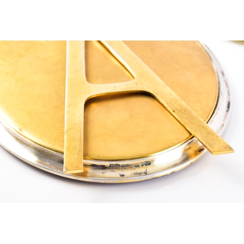 201 - A Norwegian silver gilt oval photograph frame, decorated with purple enamel, overall size 11 x 8 cm,... 