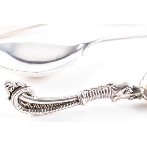 202 - A collection of assorted silver teaspoons, including British teaspoons, a caddy spoon, a Danish cadd... 