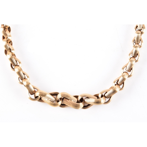 83 - A 9ct yellow gold textured graduating link chain, import marks for London 1976 by 'NB', 45 cm long.