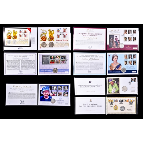 114 - A collection of commemorative coin covers and stamp collections, including a Queen Elizabeth II 65th... 