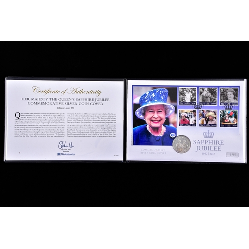 114 - A collection of commemorative coin covers and stamp collections, including a Queen Elizabeth II 65th... 