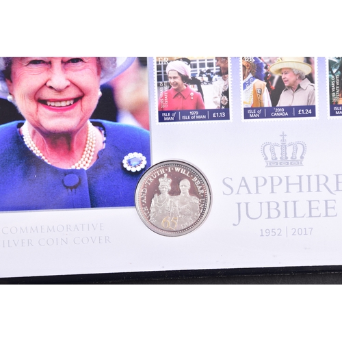 114 - A collection of commemorative coin covers and stamp collections, including a Queen Elizabeth II 65th... 