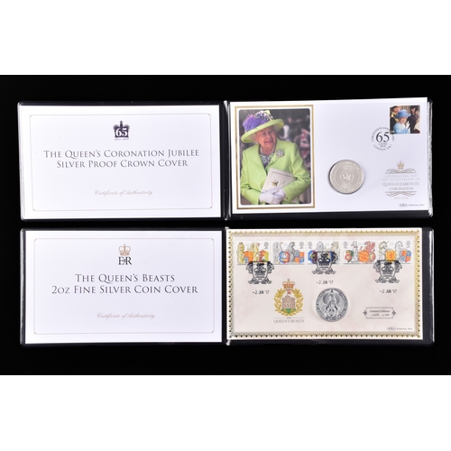 114 - A collection of commemorative coin covers and stamp collections, including a Queen Elizabeth II 65th... 