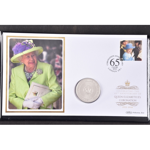 114 - A collection of commemorative coin covers and stamp collections, including a Queen Elizabeth II 65th... 