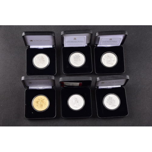 118 - A collection of commemorative coins including Queen Elizabeth II 2015 silver proof coin, a 1977 silv... 