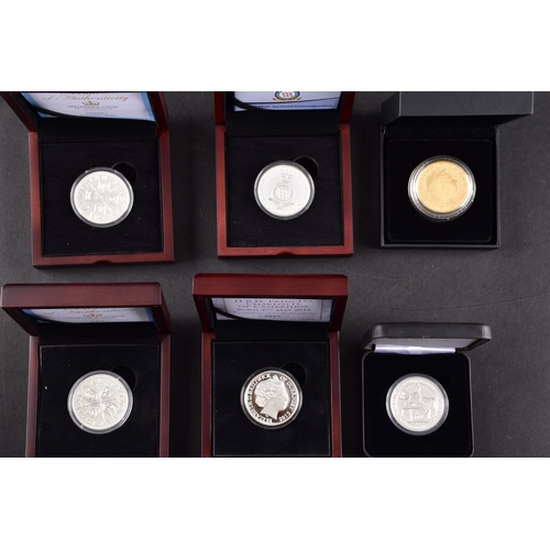 118 - A collection of commemorative coins including Queen Elizabeth II 2015 silver proof coin, a 1977 silv... 