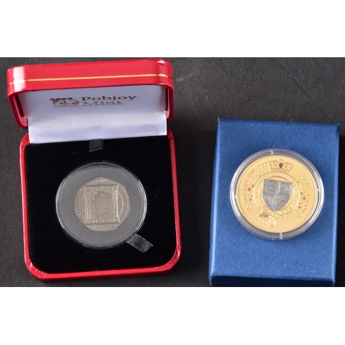 118 - A collection of commemorative coins including Queen Elizabeth II 2015 silver proof coin, a 1977 silv... 