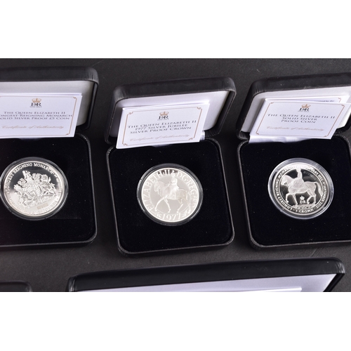 118 - A collection of commemorative coins including Queen Elizabeth II 2015 silver proof coin, a 1977 silv... 