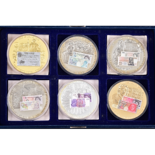 87 - Four boxed sets of Windsor Mint bank note commemorative coins.