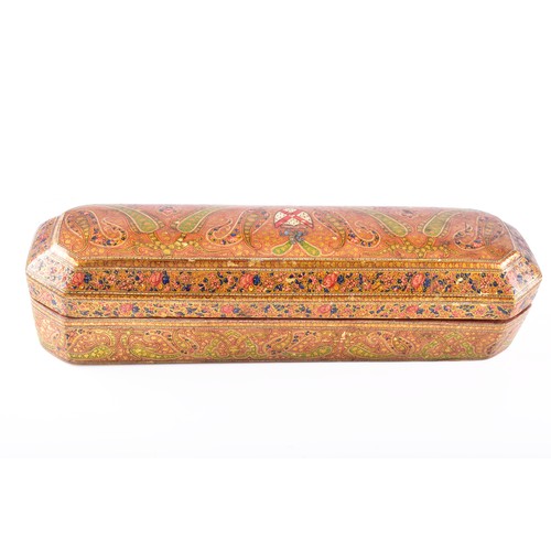 345 - A 19th century Persian papier-mache stationery box, of elongated octagonal form, the hinged cover ri... 