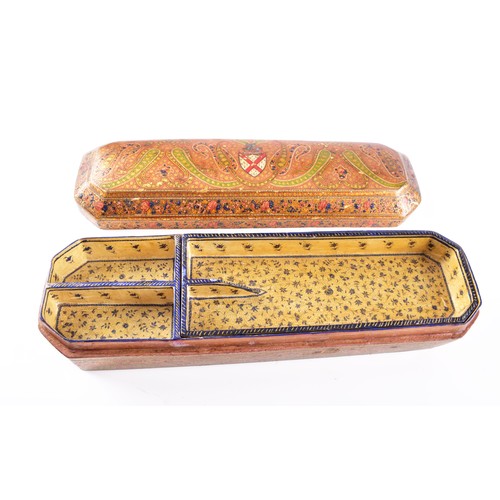 345 - A 19th century Persian papier-mache stationery box, of elongated octagonal form, the hinged cover ri... 