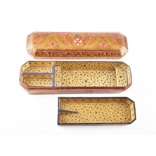 345 - A 19th century Persian papier-mache stationery box, of elongated octagonal form, the hinged cover ri... 