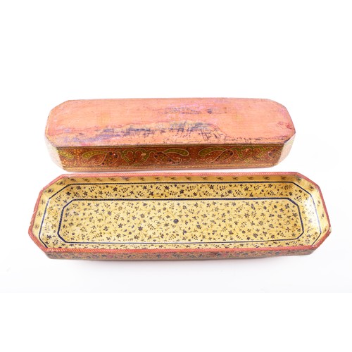 345 - A 19th century Persian papier-mache stationery box, of elongated octagonal form, the hinged cover ri... 