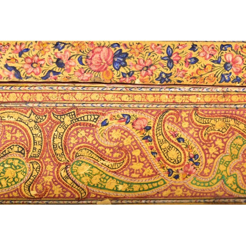345 - A 19th century Persian papier-mache stationery box, of elongated octagonal form, the hinged cover ri... 