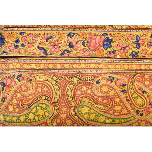 345 - A 19th century Persian papier-mache stationery box, of elongated octagonal form, the hinged cover ri... 