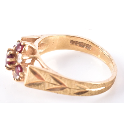 8 - Two 9ct yellow gold rings, including a garnet and paste floral cluster hallmarked for London 1977, s... 