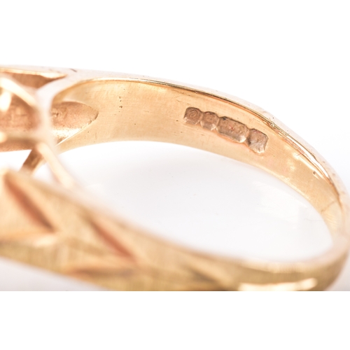 8 - Two 9ct yellow gold rings, including a garnet and paste floral cluster hallmarked for London 1977, s... 