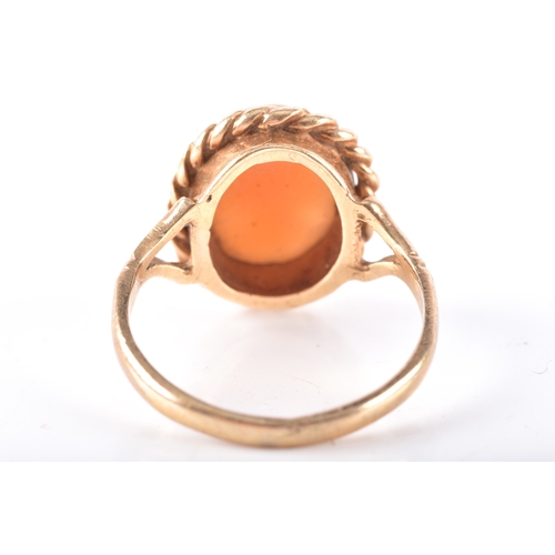 8 - Two 9ct yellow gold rings, including a garnet and paste floral cluster hallmarked for London 1977, s... 