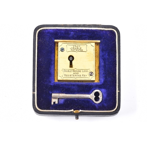 220 - A 1920 J. Gable patented gilt brass double secure lock and registering key mechanism, of rectangular... 