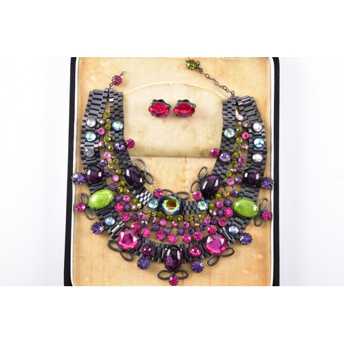 77 - A mid to late 20th century statement costume necklace and matching earrings, the necklace formed as ... 