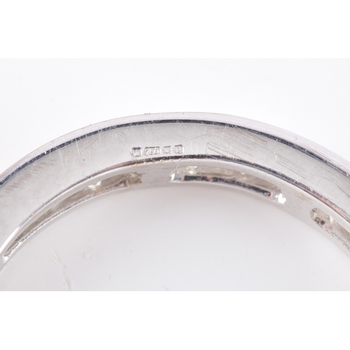 14 - An 18ct white gold diamond full eternity ring, featuring princess cut diamonds with an approximate c... 