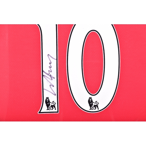 350 - A framed Manchester United red home shirt, the reverse printed 'Rooney' and numbered 10, signed in b... 