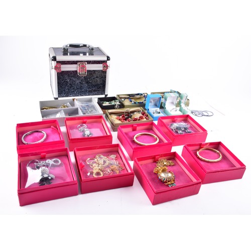 71 - A large collection of Butler & Wilson pieces, including three bangles, four key rings, a owl nec... 