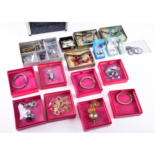 71 - A large collection of Butler & Wilson pieces, including three bangles, four key rings, a owl nec... 