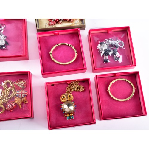 71 - A large collection of Butler & Wilson pieces, including three bangles, four key rings, a owl nec... 