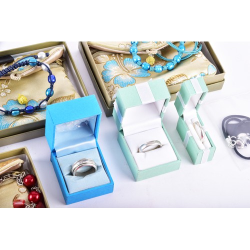 71 - A large collection of Butler & Wilson pieces, including three bangles, four key rings, a owl nec... 