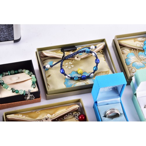 71 - A large collection of Butler & Wilson pieces, including three bangles, four key rings, a owl nec... 