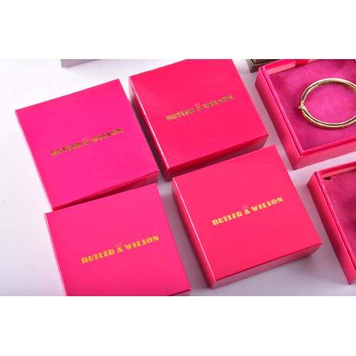 71 - A large collection of Butler & Wilson pieces, including three bangles, four key rings, a owl nec... 