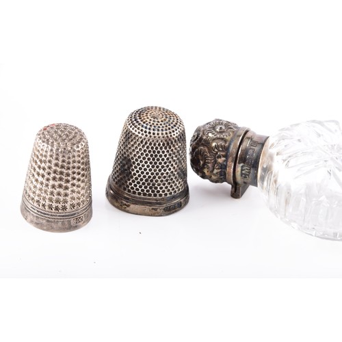 211 - A group lot of assorted silver and other items, a pair of Victorian sugar tongs hallmarked for Londo... 