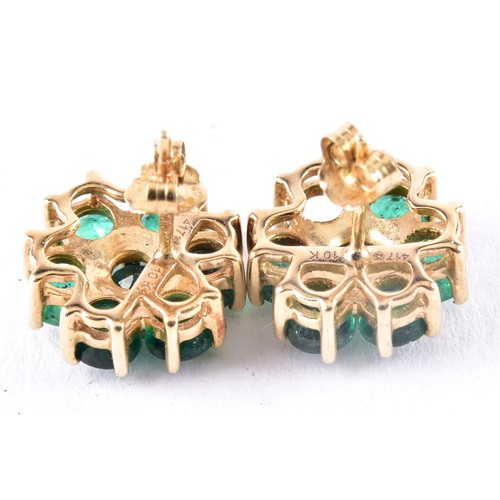 35 - A pair of 10ct yellow gold floral emerald cluster earrings, (one loose stone), each 1 cm diameter, w... 