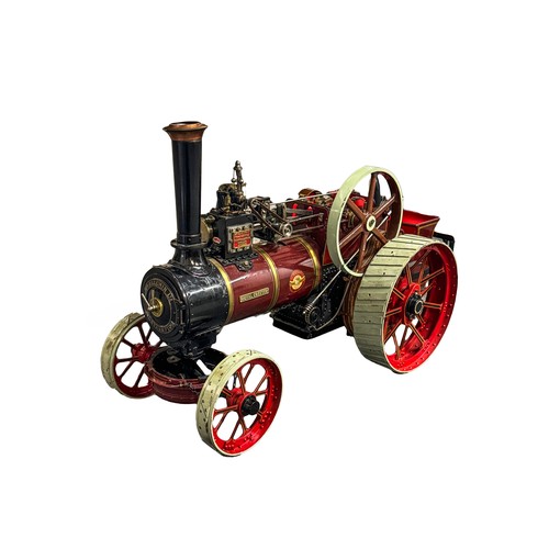 A finely executed scratch-built live steam traction engine model, 'Royal Chester', after the W. Allchin agricultural engines of Northampton, finished in lined maroon and black livery with red spoked wheels and pale straked tyres, the detailed single-cylinder live steam mechanism with brass and steel fittings, simulated boiler bands, chimney, driver’s platform and rear tender, bearing maker’s plaques and transfer marks for W. Allchin Ltd Engineers, Northampton, England, no. 3251, accompanied by a fitted wooden plinth for mounting and a glazed display case (missing one end), traction engine 48 cm long.