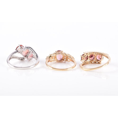 54 - A 9ct yellow gold and pink tourmaline ring, with stepped shoulders inset with white stone accents, s... 