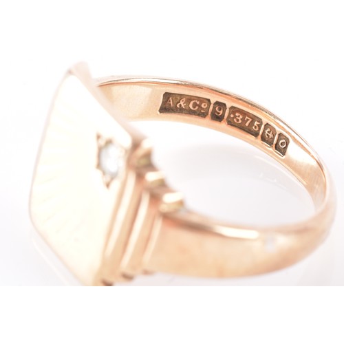 50 - A 9ct yellow gold diamond set signet ring, set with a round brilliant cut diamond with an approximat... 