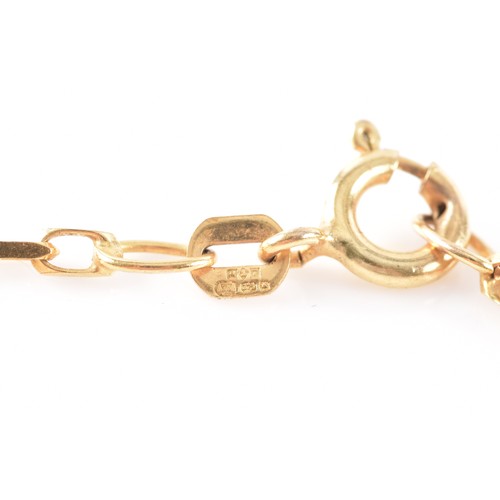 51 - A yellow metal tiger's eye pendant, on a 9ct yellow gold chain, 50 cm long.