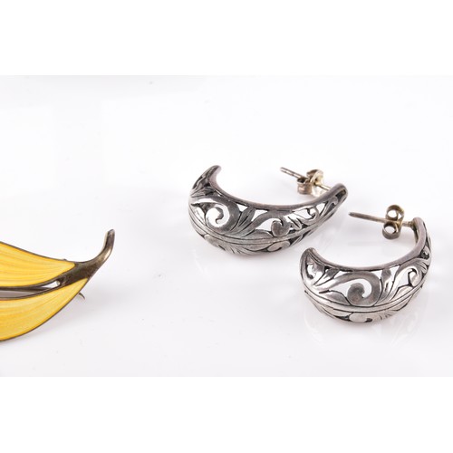 13 - A vintage Norweigan sterling silver yellow enamel leaf brooch, together with a sterling silver locke... 