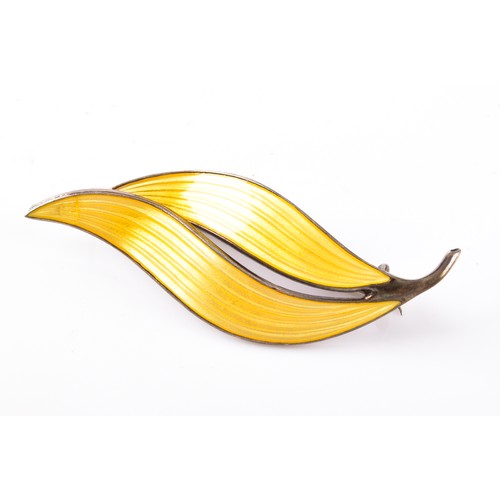 13 - A vintage Norweigan sterling silver yellow enamel leaf brooch, together with a sterling silver locke... 