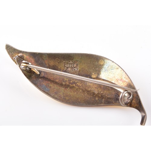 13 - A vintage Norweigan sterling silver yellow enamel leaf brooch, together with a sterling silver locke... 