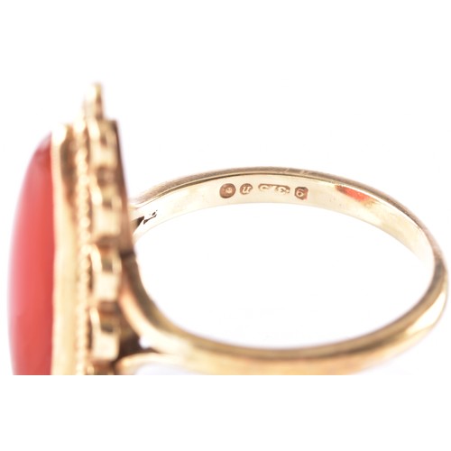 9 - A 9ct yellow gold marquise carnelian cocktail ring, with scalloped wirework bezel, hallmarked for Lo... 