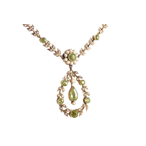 11 - A late 19th/early 20th century 9ct gold peridot and seed pearl necklace, of openwork foliate and gar... 