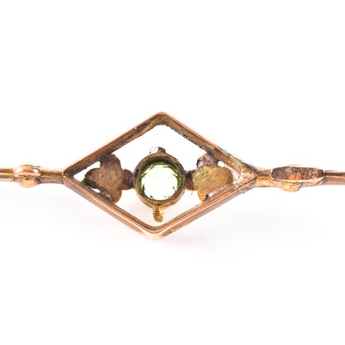 17 - A 9ct yellow gold peridot and seed pearl openwork pendant, 2.3 cm diameter, together with a peridot ... 