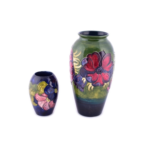37 - Two Moorcroft vases, including a Hibiscus pattern vase, 25 cm high, together with a small Moorcroft ... 
