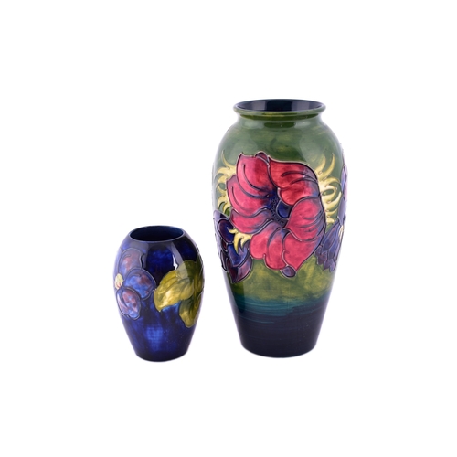 37 - Two Moorcroft vases, including a Hibiscus pattern vase, 25 cm high, together with a small Moorcroft ... 