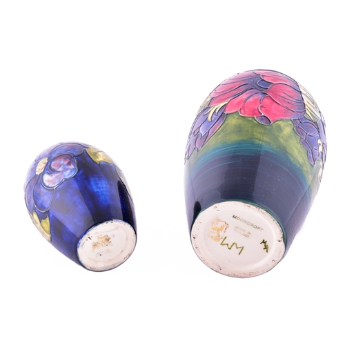 37 - Two Moorcroft vases, including a Hibiscus pattern vase, 25 cm high, together with a small Moorcroft ... 